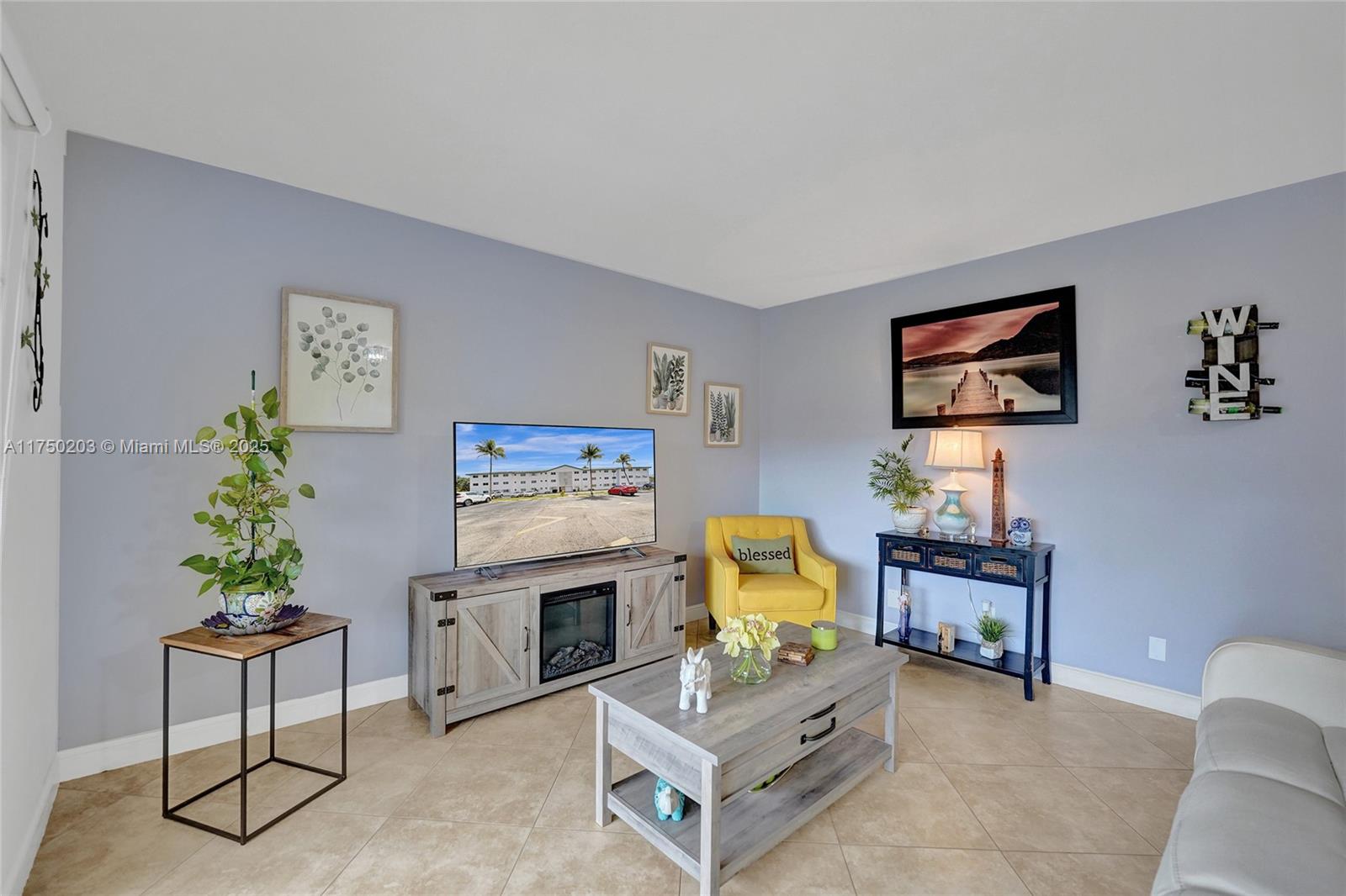 5300 Washington Street, Unit I203 Hollywood, FL 33021 - Photo 2 of 75 a living room with furniture and a work place
