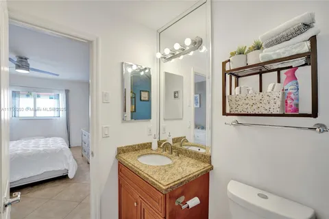 a bedroom that has a bed and a chair in it