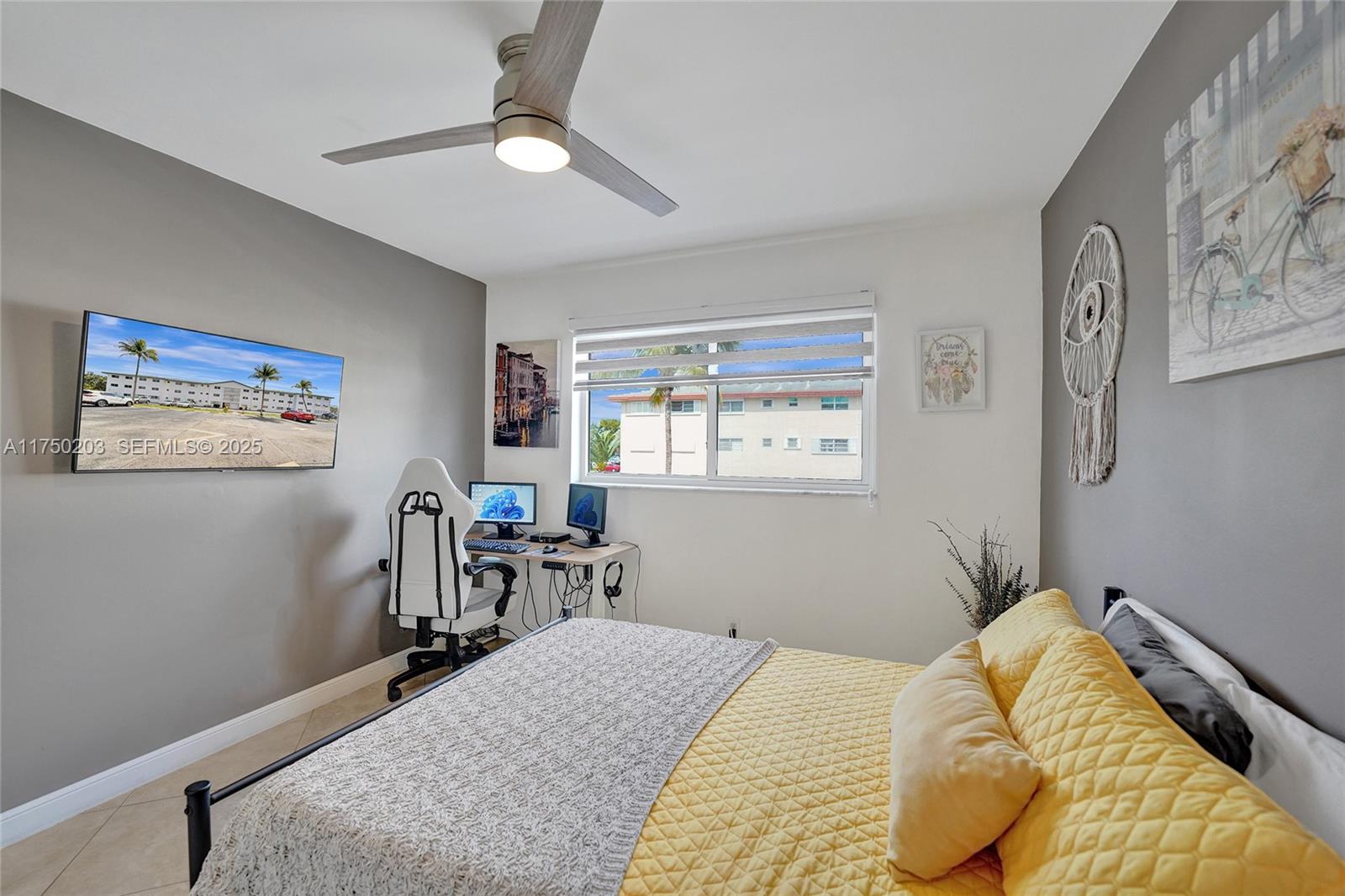 5300 Washington Street, Unit I203 Hollywood, FL 33021 - Photo 42 of 75 a bedroom with a bed and a chair