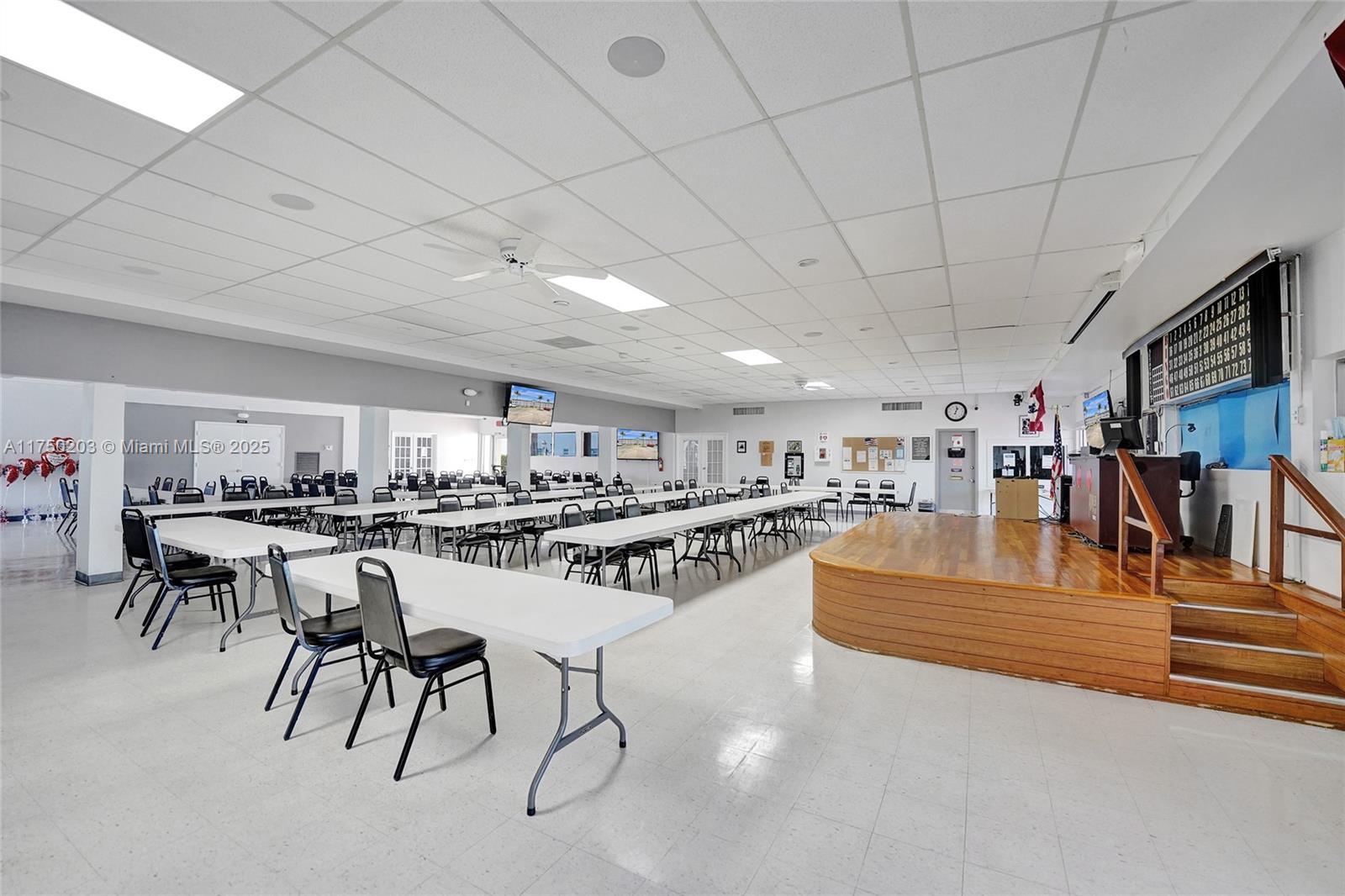 5300 Washington Street, Unit I203 Hollywood, FL 33021 - Photo 63 of 75 a living room with lots of furniture and a kitchen view