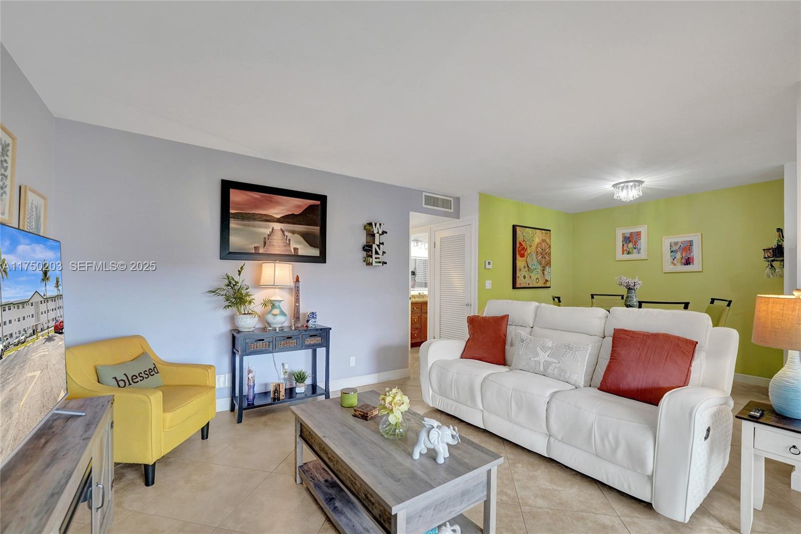 5300 Washington Street, Unit I203 Hollywood, FL 33021 - Photo 9 of 75 a living room with furniture and painting on the wall