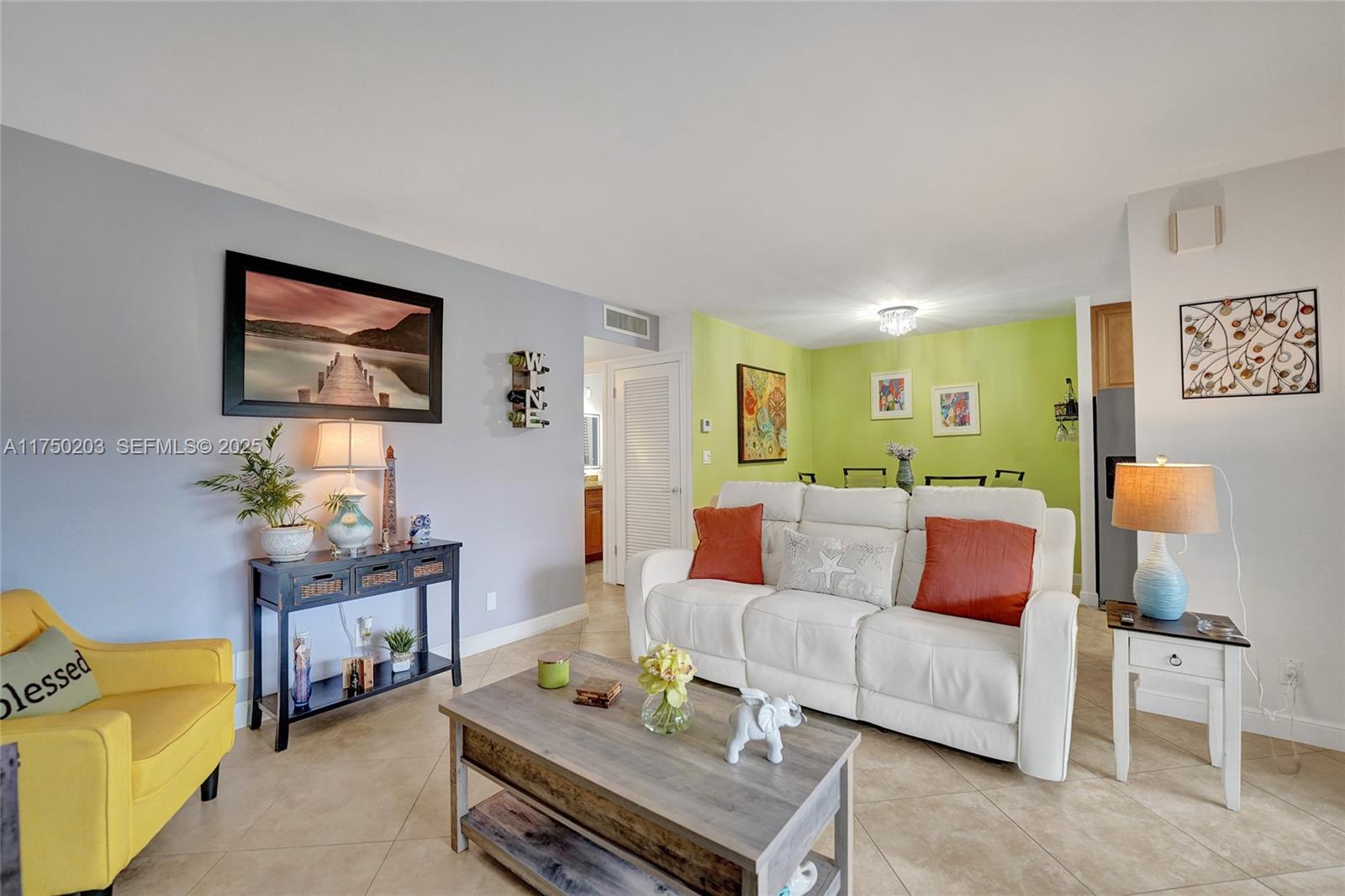 5300 Washington Street, Unit I203 Hollywood, FL 33021 - Photo 10 of 75 a living room with furniture and a lamp