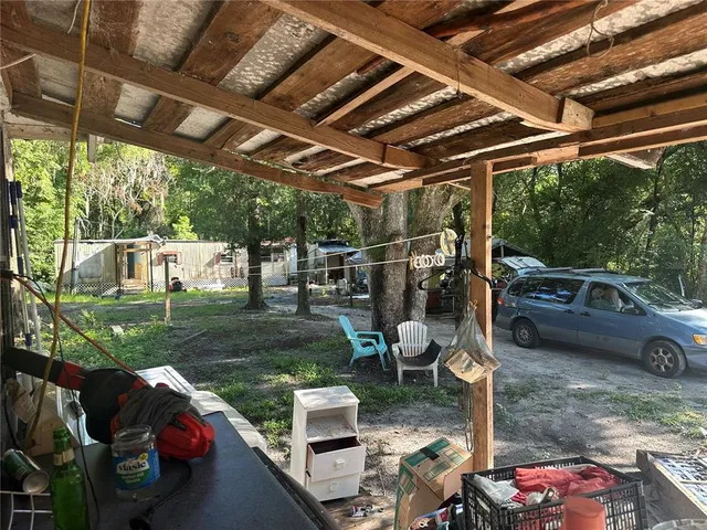 a view of yard with patio