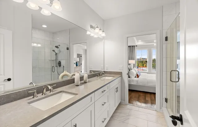 a bathroom with a double vanity sink mirror and double