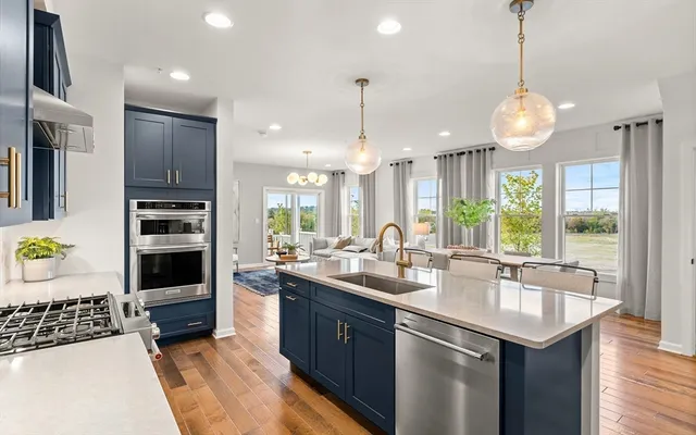 a kitchen with sink cabinets and window