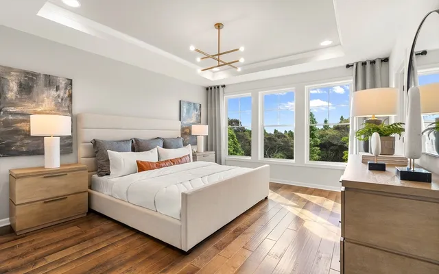 a bedroom with a large bed and a large window