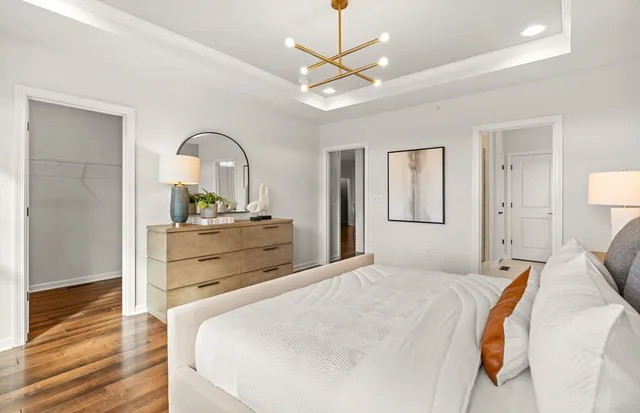 a bedroom with a bed and a dresser