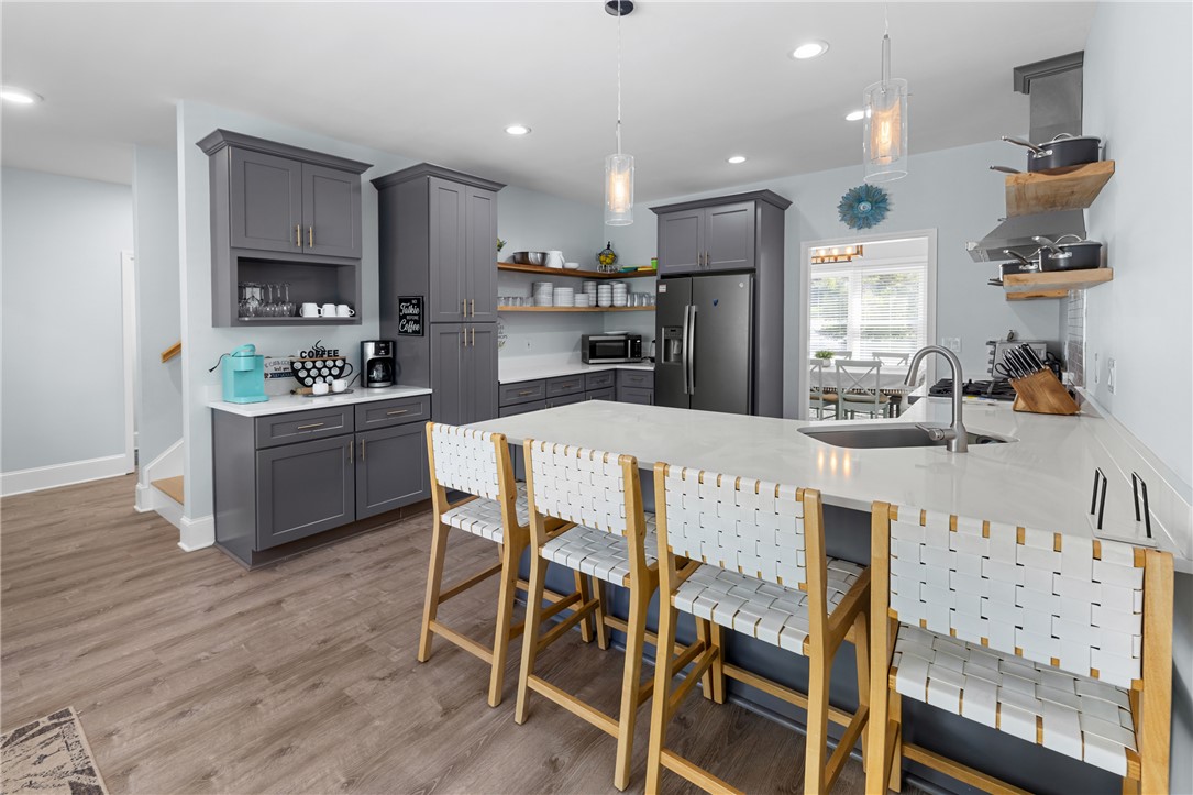 206 Petty Road Seneca, SC 29672 - Photo 11 of 47 Modern kitchen with sleek cabinetry and a generously sized island perfect for entertaining.
