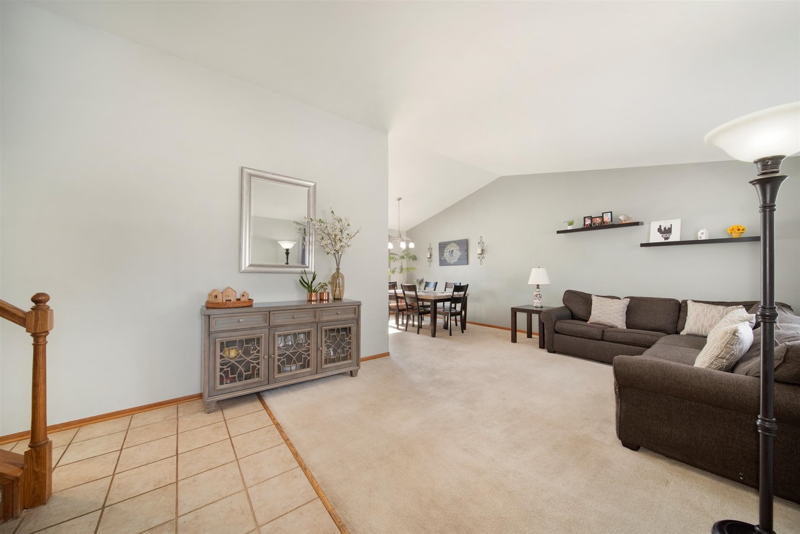 146 Sumac Lane Schaumburg, IL 60193 - Photo 2 of 24 a living room with furniture and a dining table