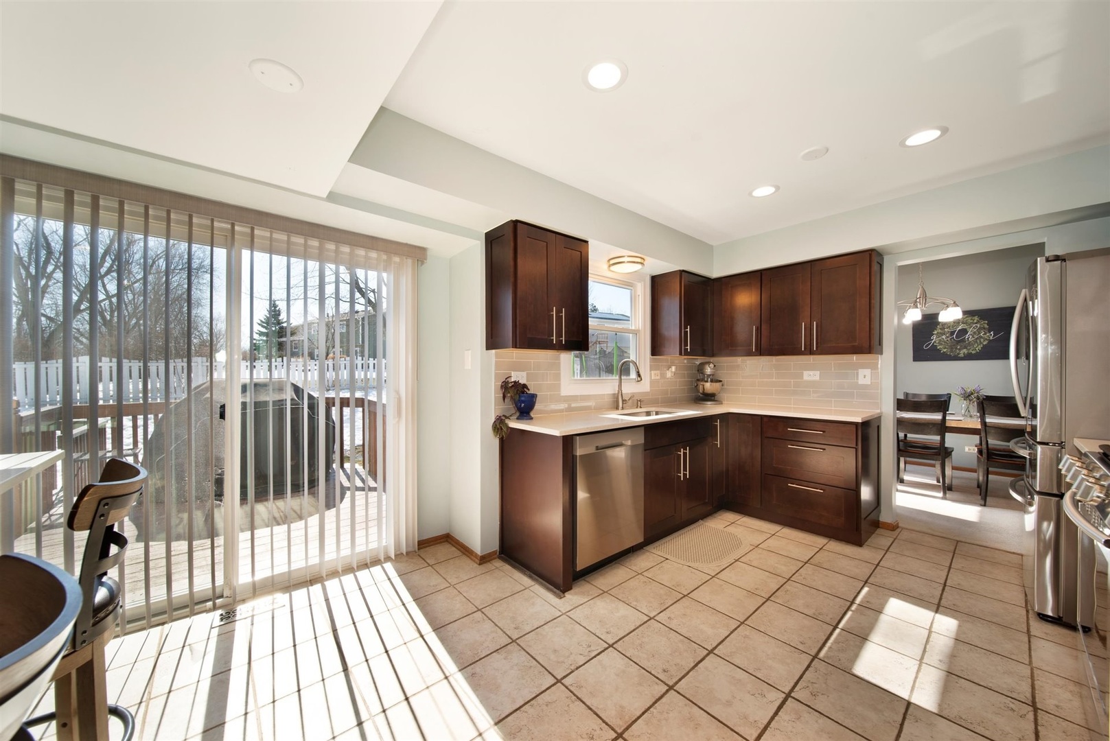 146 Sumac Lane Schaumburg, IL 60193 - Photo 4 of 24 a kitchen with stainless steel appliances granite countertop a stove a sink and a refrigerator