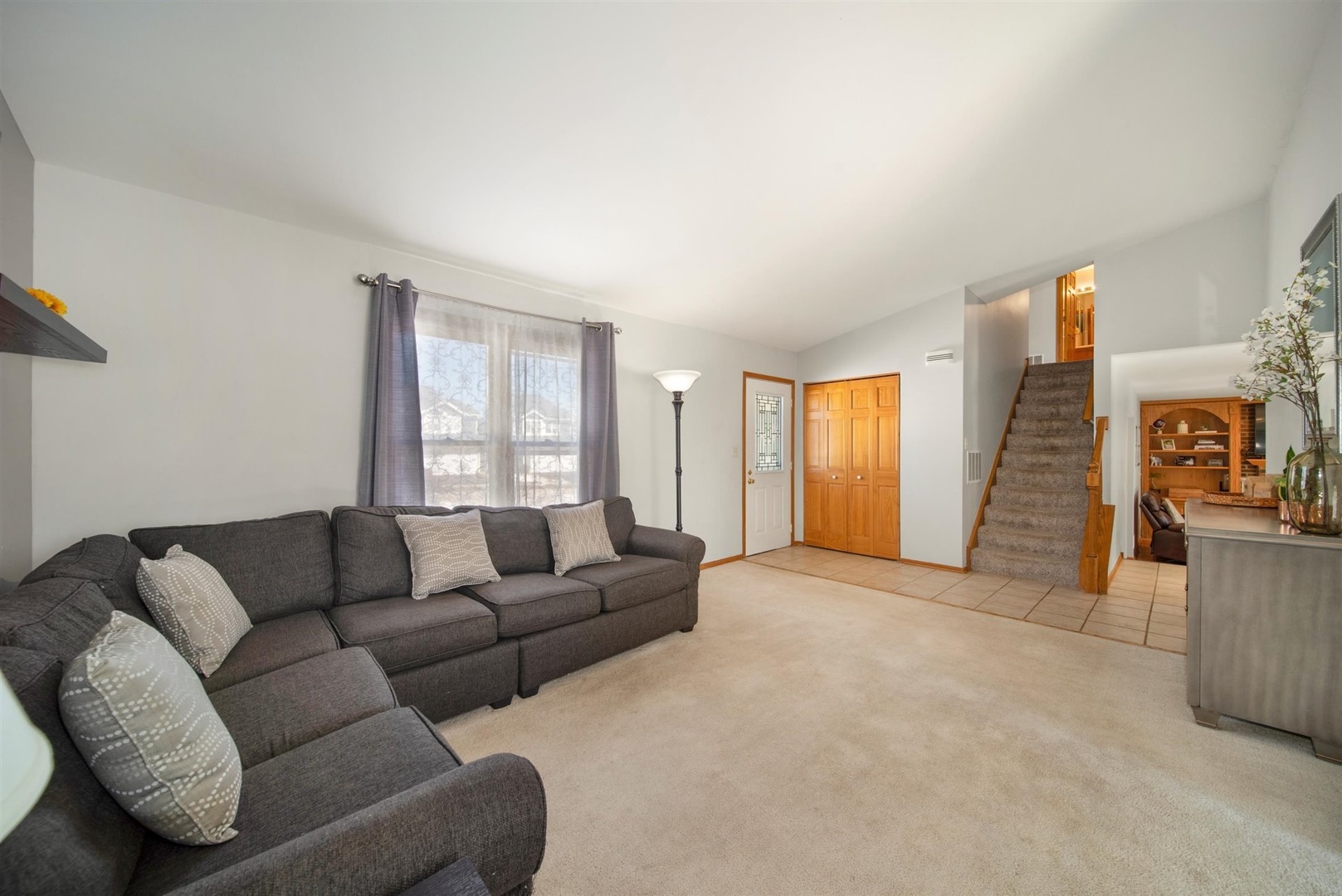 146 Sumac Lane Schaumburg, IL 60193 - Photo 8 of 24 a living room with furniture and a window