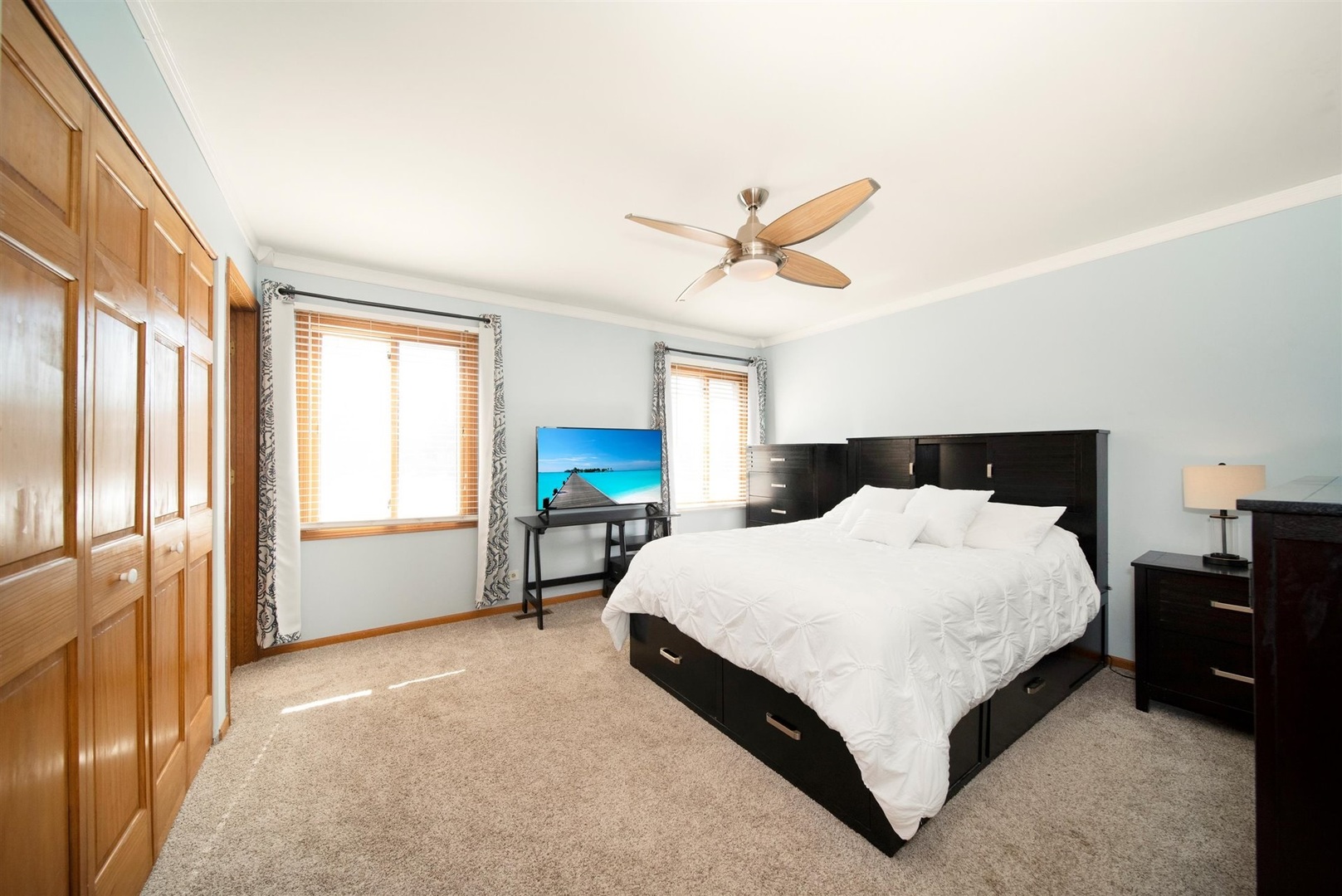 146 Sumac Lane Schaumburg, IL 60193 - Photo 9 of 24 a spacious bedroom with a bed and a large window