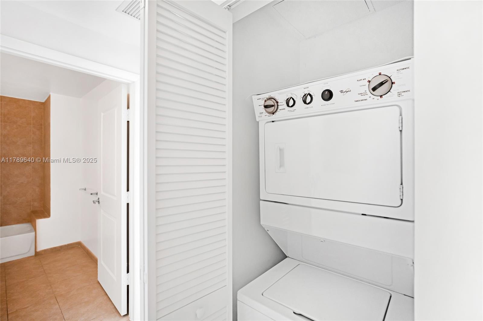 2641 North Flamingo Road, Unit 2608N Sunrise, FL 33323 - Photo 13 of 15 a utility room with dryer and washer