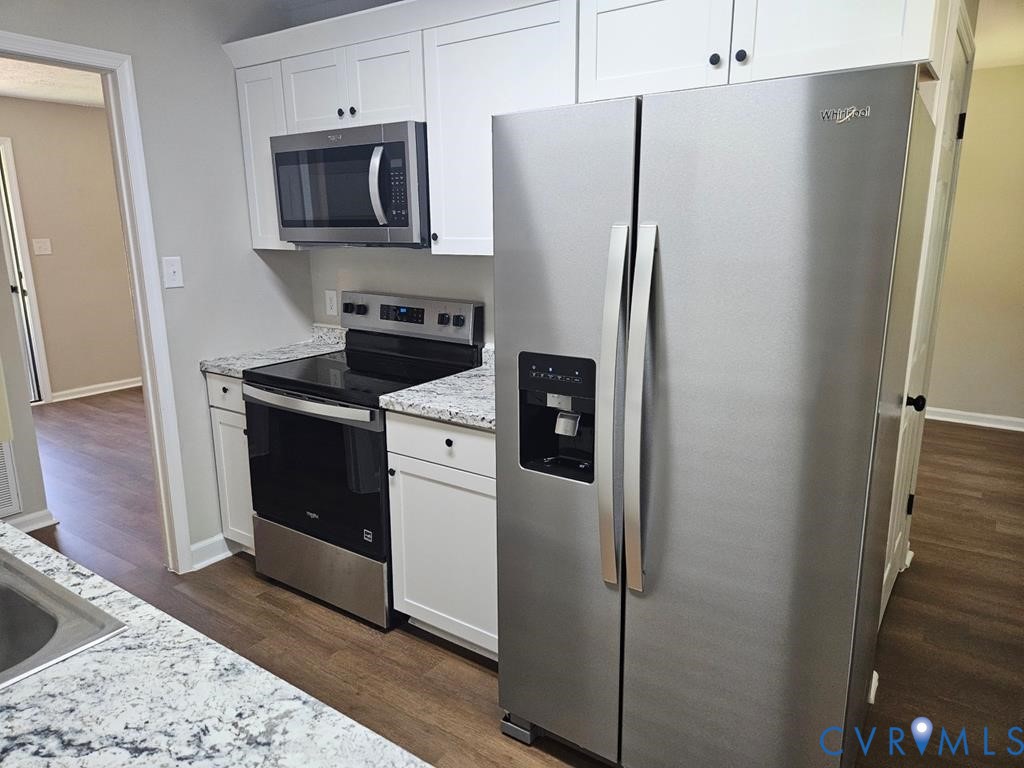 27368 Prince Edward Highway Rice, VA 23966 - Photo 6 of 18 a kitchen with stainless steel appliances a refrigerator stove and microwave