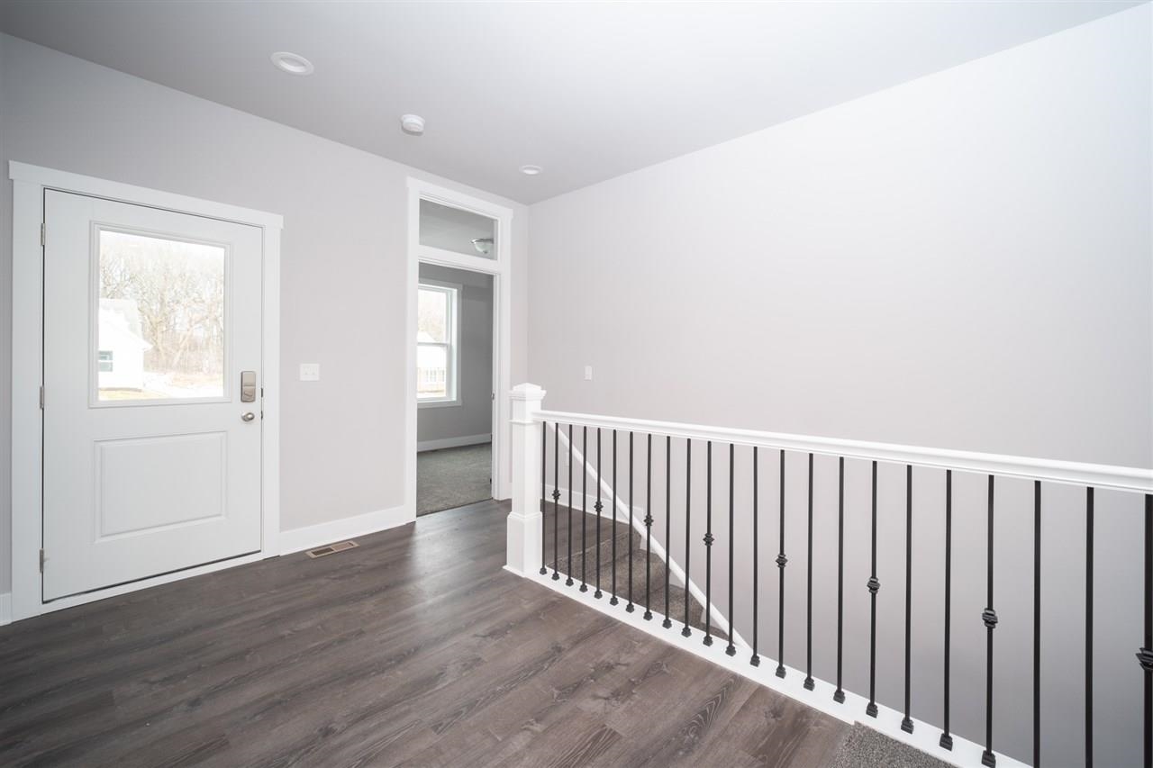 2510 Court Ridge Road Belvidere, IL 61008 - Photo 4 of 22 a view of a hallway with wooden floor