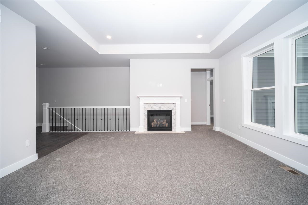 2510 Court Ridge Road Belvidere, IL 61008 - Photo 6 of 22 a view of a livingroom with a fireplace and large window