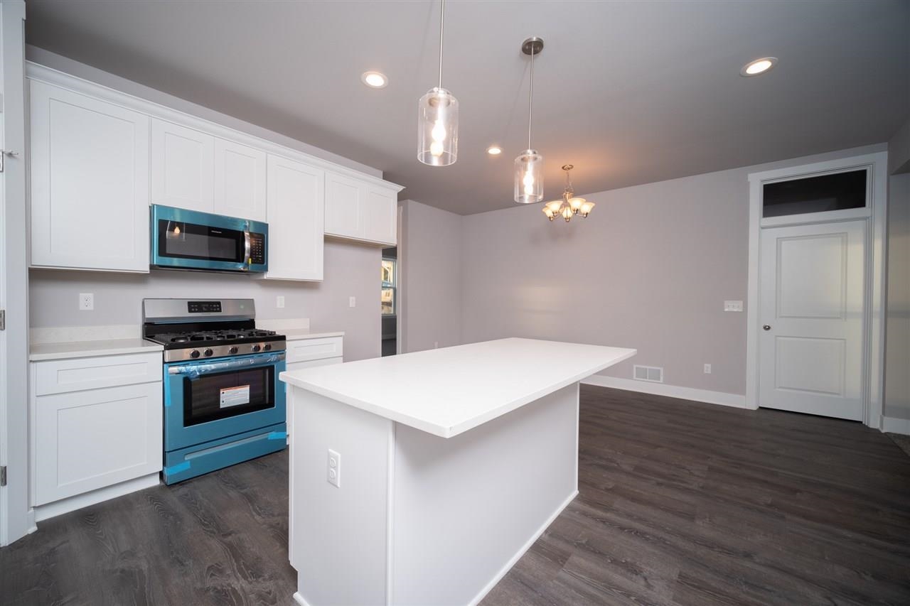 2510 Court Ridge Road Belvidere, IL 61008 - Photo 10 of 22 a kitchen with a stove a sink and a refrigerator