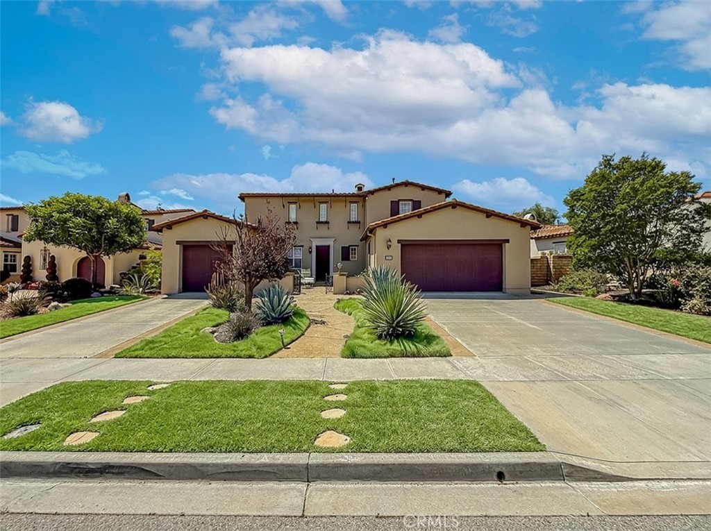 5244 Via Rincon Newbury Park, CA 91320 - Photo 1 of 19 a front view of a house with a garden