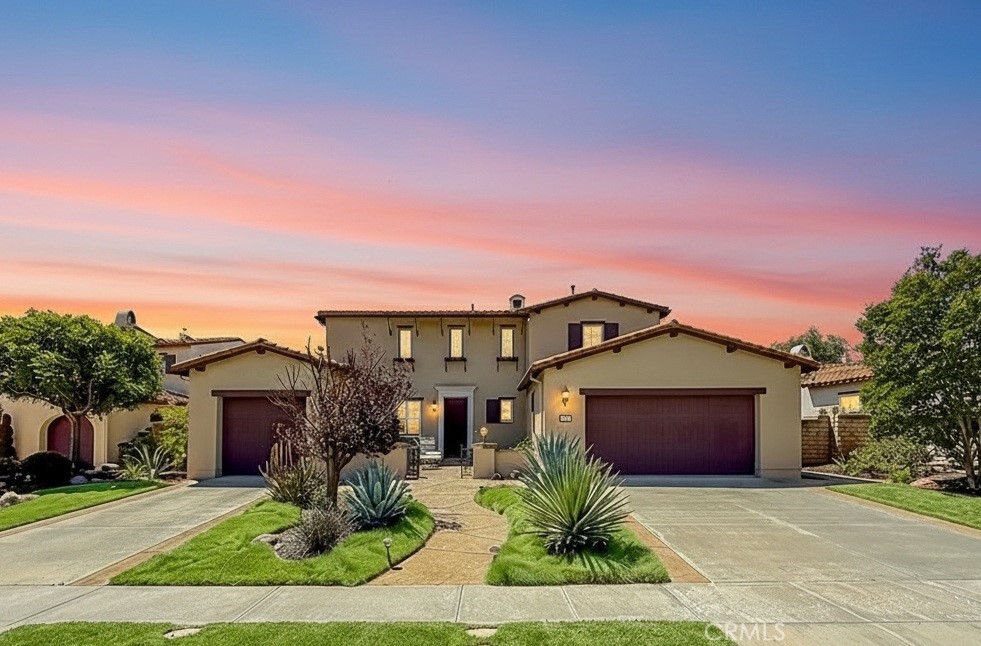 5244 Via Rincon Newbury Park, CA 91320 - Photo 3 of 19 a front view of a house with a yard and garage