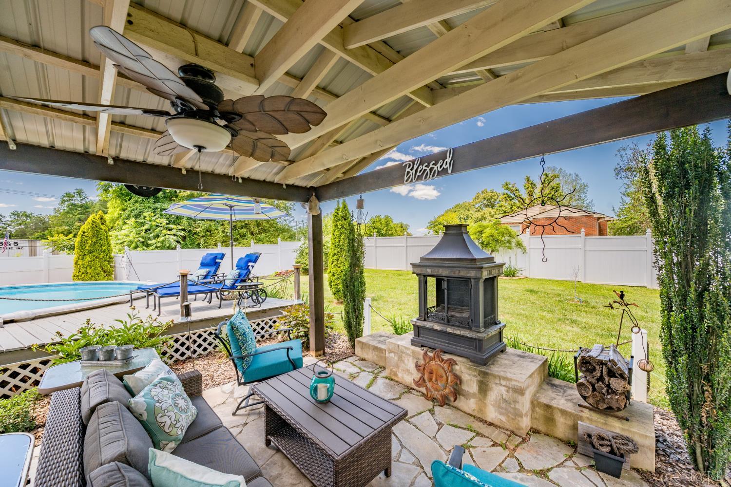 232 Elon Road Madison Heights, VA 24572 - Photo 45 of 65 Covered poolside patio creating the perfect space for year-round entertaining and relaxation.