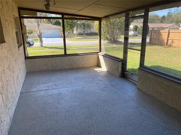 a view of an empty room with a large window