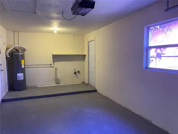 a view of a closet area with wooden floor