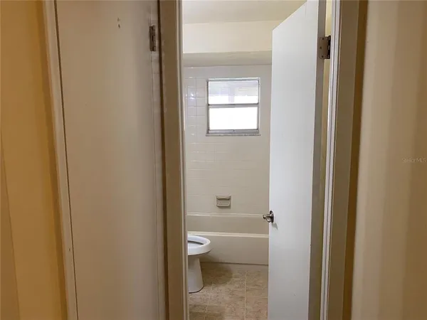 a bathroom with a granite countertop window