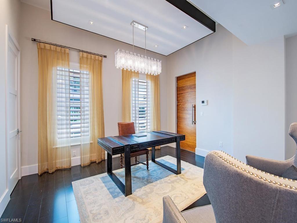490 5th Street South, Unit 101 Naples, FL 34102 - Photo 10 of 34 a living room with furniture and a window