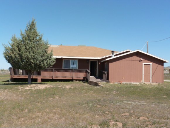 550 West Ranch House Road Paulden, AZ 86334 - Photo 1 of 6 a view of a house with a yard