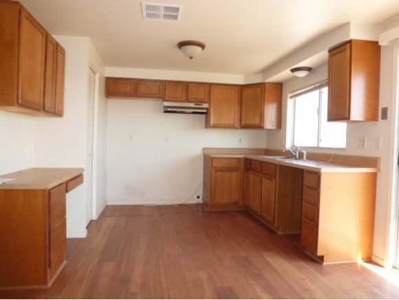 550 West Ranch House Road Paulden, AZ 86334 - Photo 4 of 6 a kitchen with sink cabinets and window