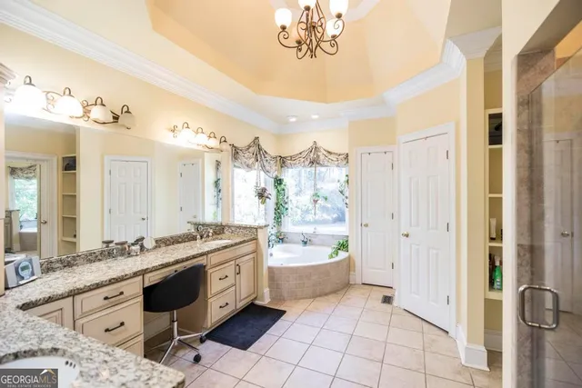 a bathroom with a glass shower door