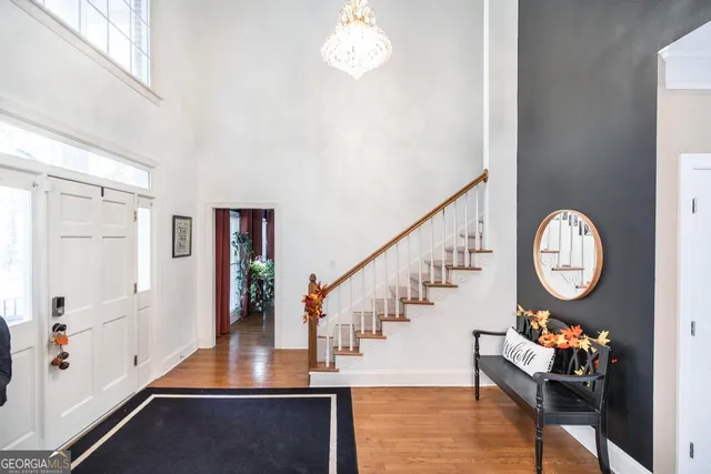 a view of entryway dining room and hall with wooden floor