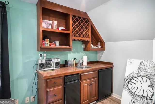 a view of a livingroom with furniture window and wooden floor