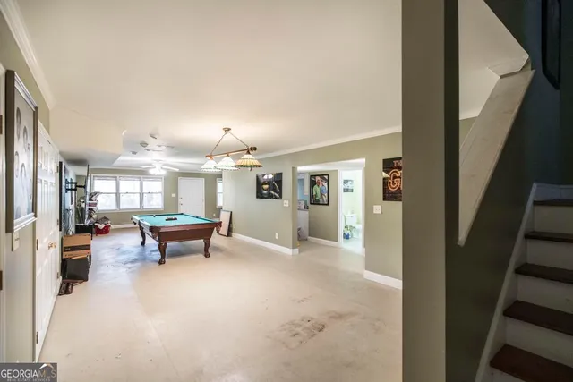 a living room with furniture a dining table and kitchen view