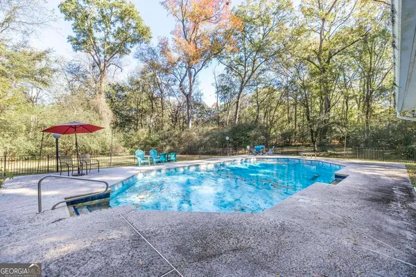 a view of a house with swimming pool