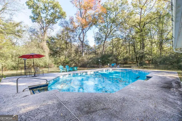 a view of a house with swimming pool