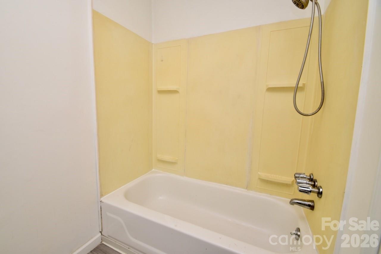 2007 South York Road Gastonia, NC 28052 - Photo 17 of 26 a bathroom with a white bath tub and a shower