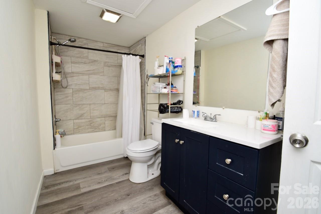 2007 South York Road Gastonia, NC 28052 - Photo 9 of 26 a bathroom with a sink toilet a mirror and shower