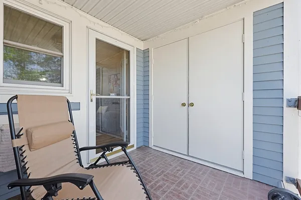 a view of a room with furniture and windows