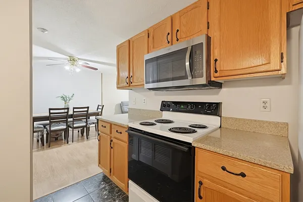 a kitchen with a stove and a microwave