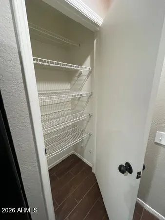 a bathroom with a walk in shower and a sink