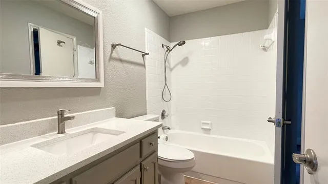 a bathroom with a sink a toilet and a bathtub