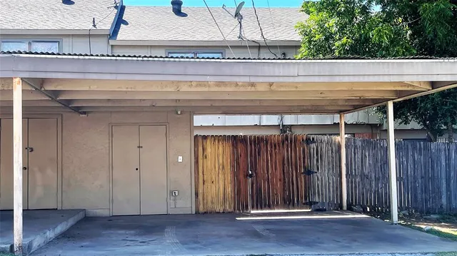 a view of wooden floor with a table and chairs
