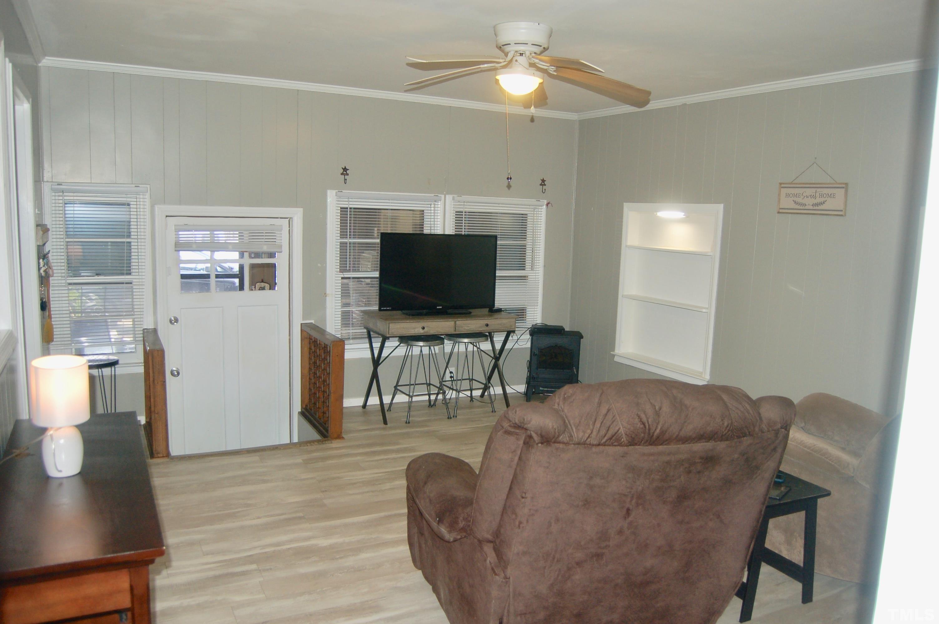 1096 Core Road Dunn, NC 28334 - Photo 8 of 15 a living room with furniture and a flat screen tv