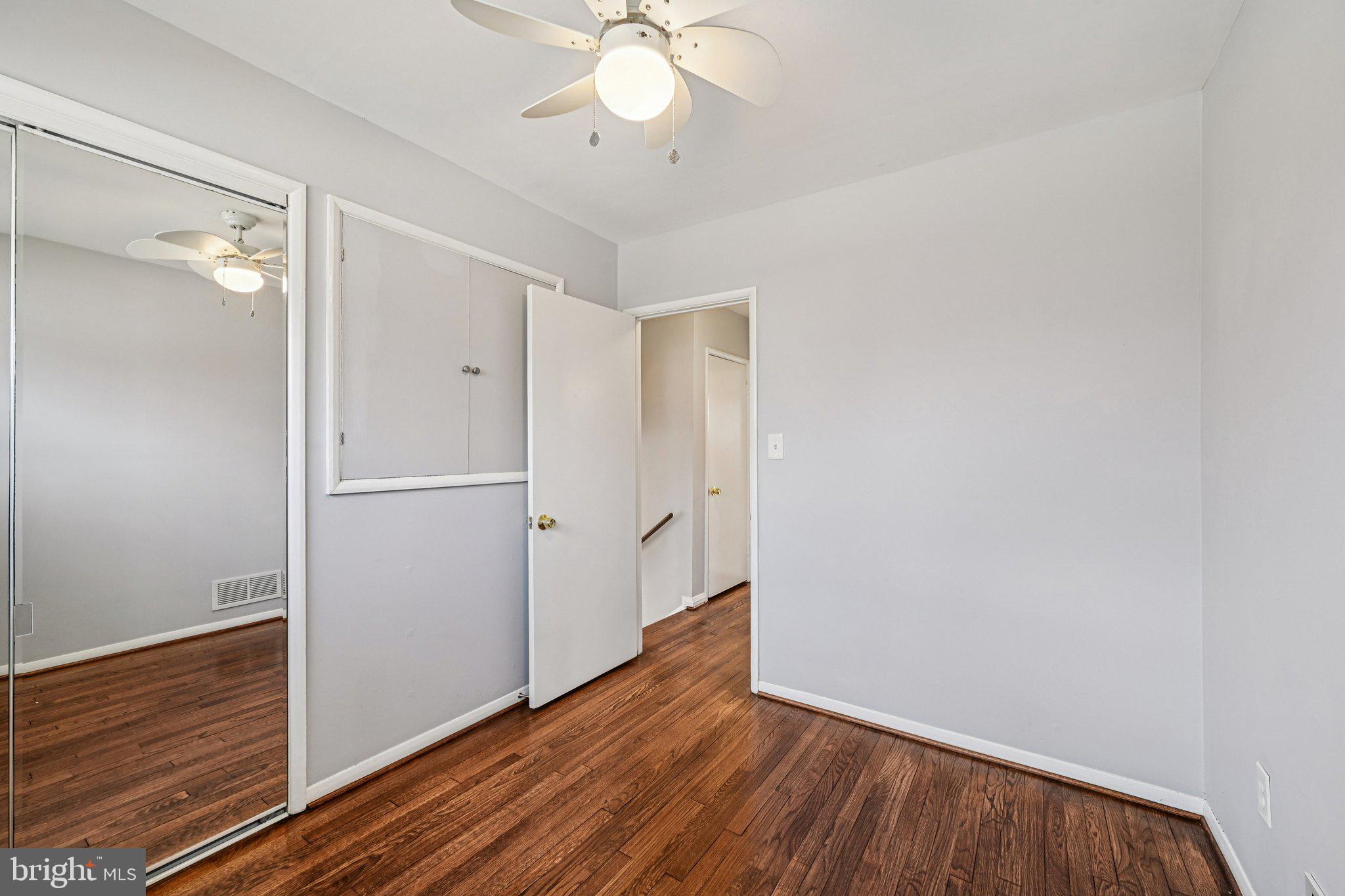 6003 Johnnycake Road Catonsville, MD 21228 - Photo 28 of 49 Bedroom three hardwood floors and ceiling fan