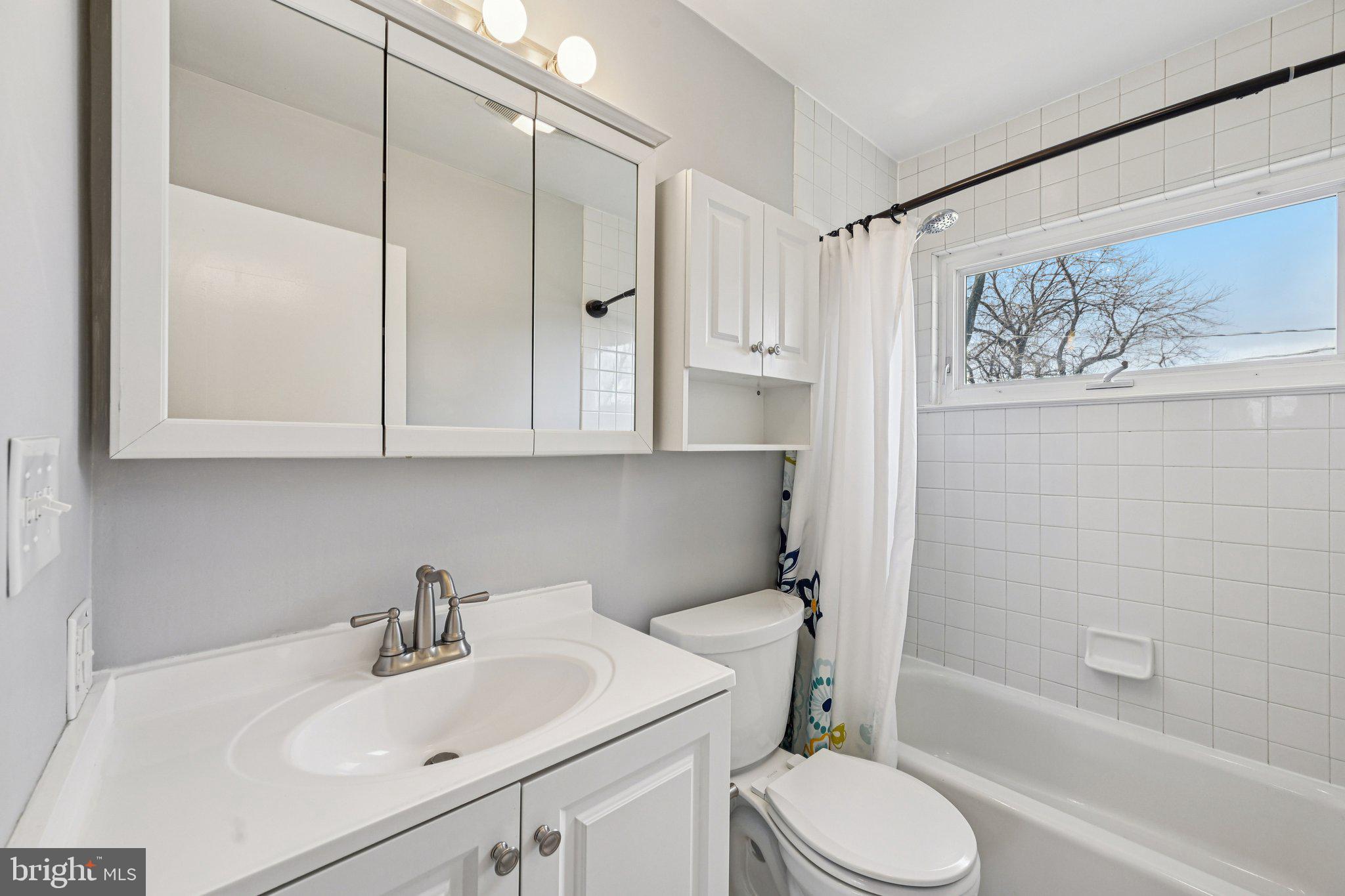 6003 Johnnycake Road Catonsville, MD 21228 - Photo 31 of 49 Full hall bathroom with modern touches, window