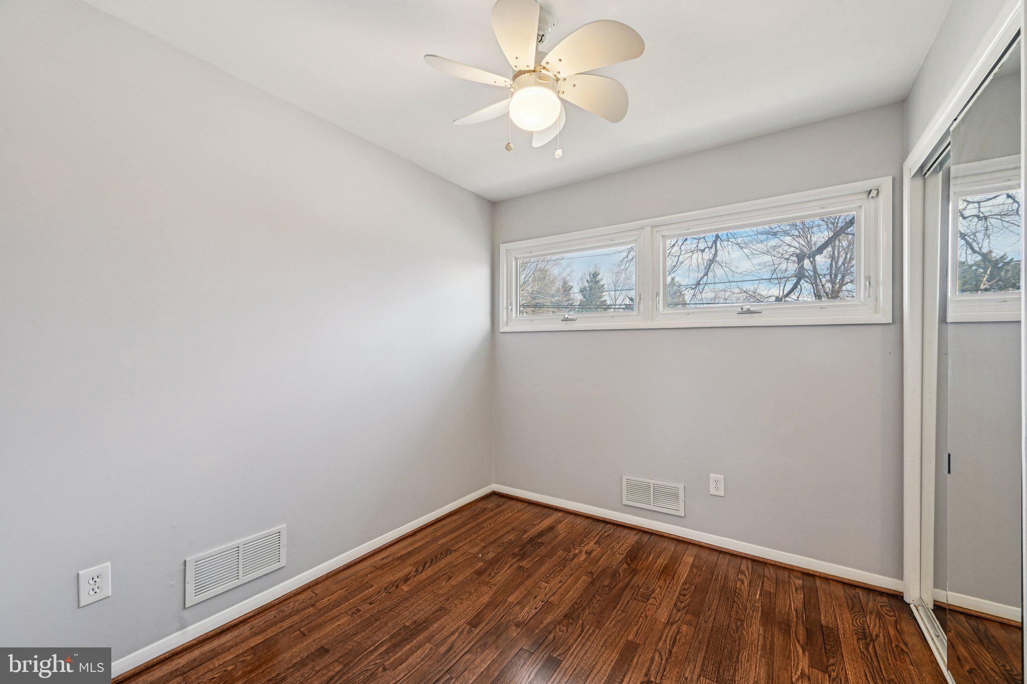 6003 Johnnycake Road Catonsville, MD 21228 - Photo 35 of 59 Bedroom three hardwood floors and ceiling fan