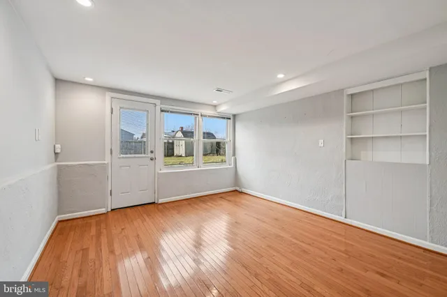 a bathroom with a toilet a sink and a mirror