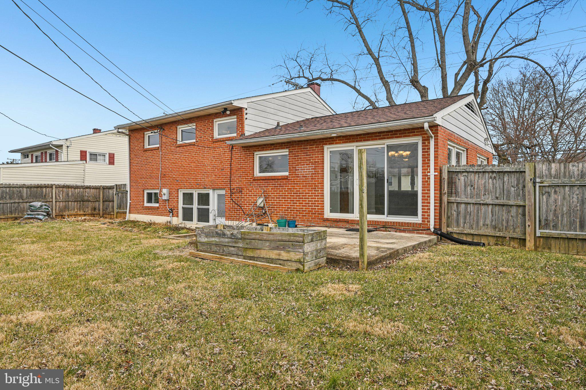 6003 Johnnycake Road Catonsville, MD 21228 - Photo 40 of 49 Rear view of home sliding door off living room