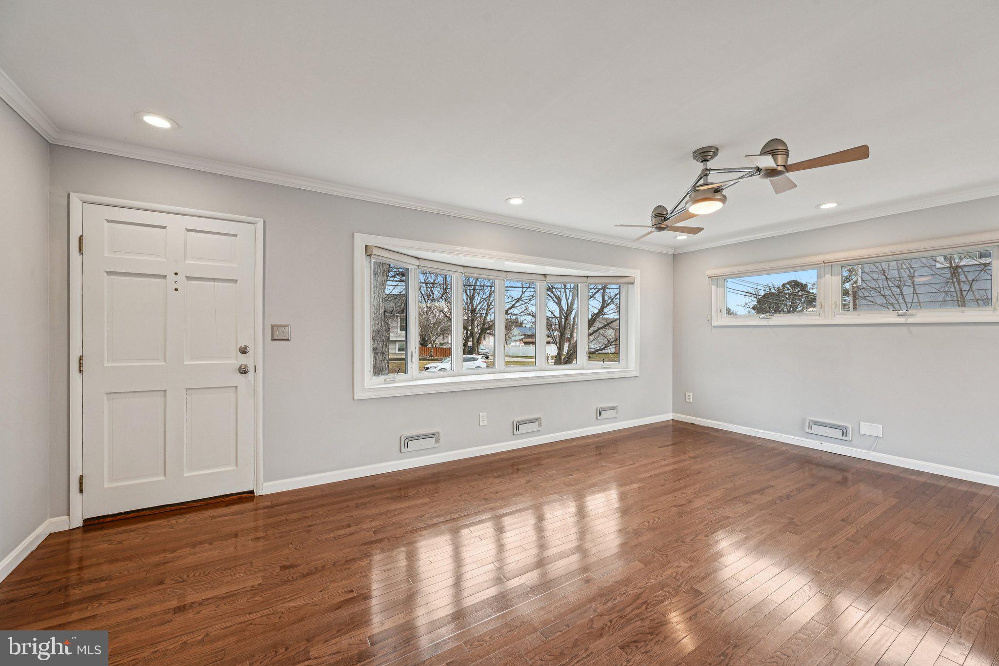 6003 Johnnycake Road Catonsville, MD 21228 - Photo 10 of 59 LR with gleaming hardwood floors, bay window